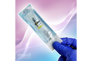 Gloved hand holding a dental polisher in a sterilization pouch