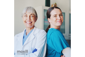 Smiling dental professionals standing back to back