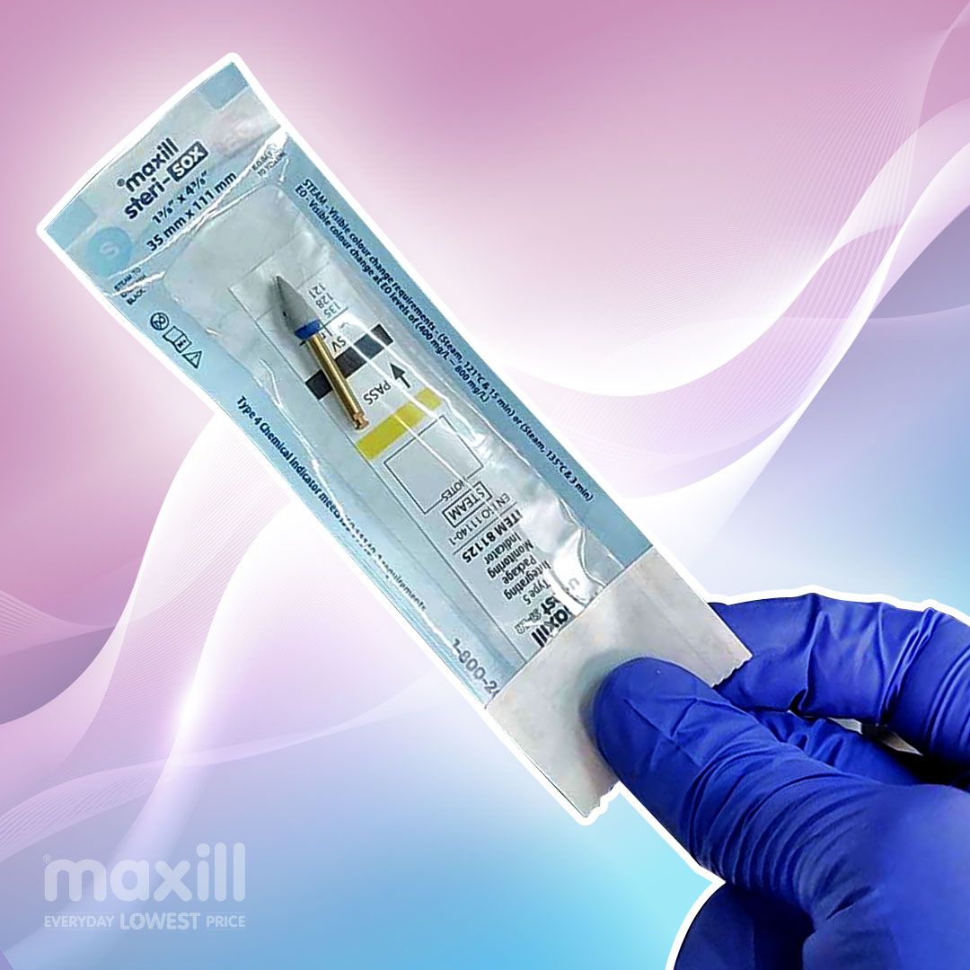 Gloved hand holding a dental polisher in a sterilization pouch