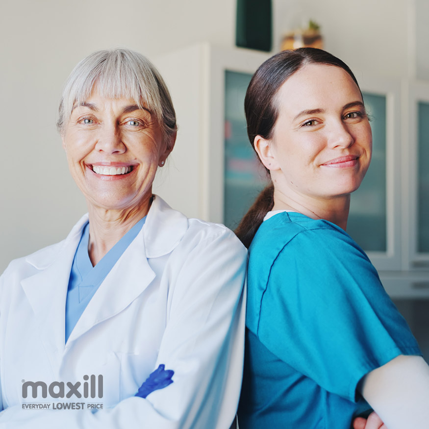 Smiling dental professionals standing back to back