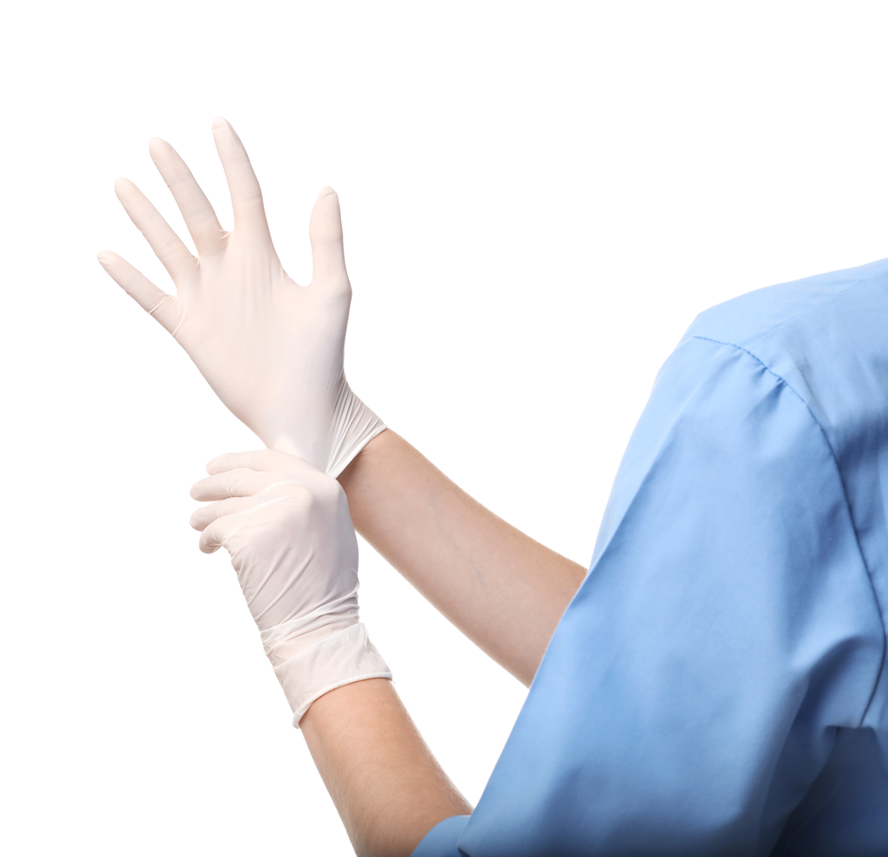 Woman putting on a nitrile glove 